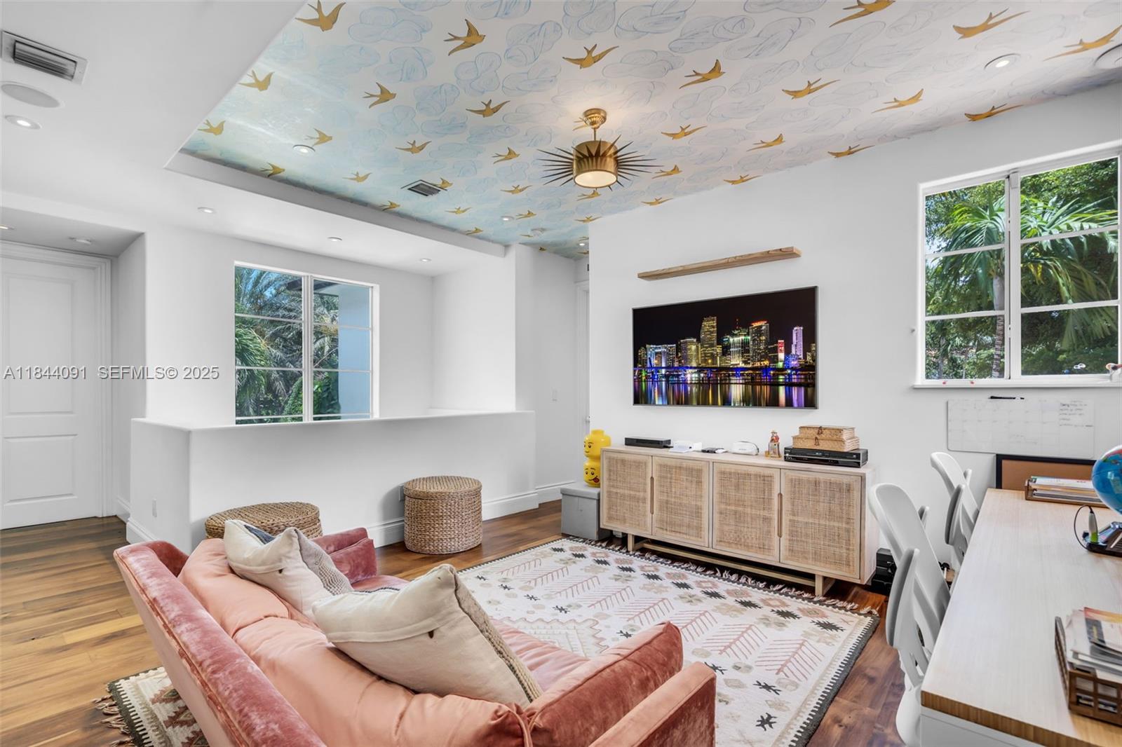 7320 Southwest 79th Court Miami, FL 33143 - Photo 60 of 89 a living room with furniture and a flat screen tv