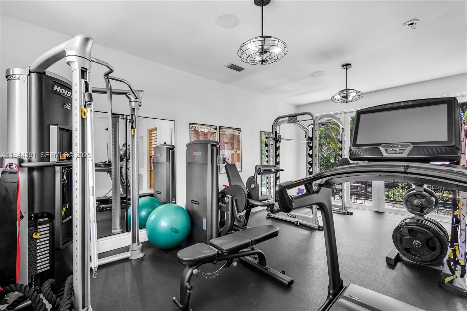 7320 Southwest 79th Court Miami, FL 33143 - Photo 74 of 89 a view of a room with gym equipment