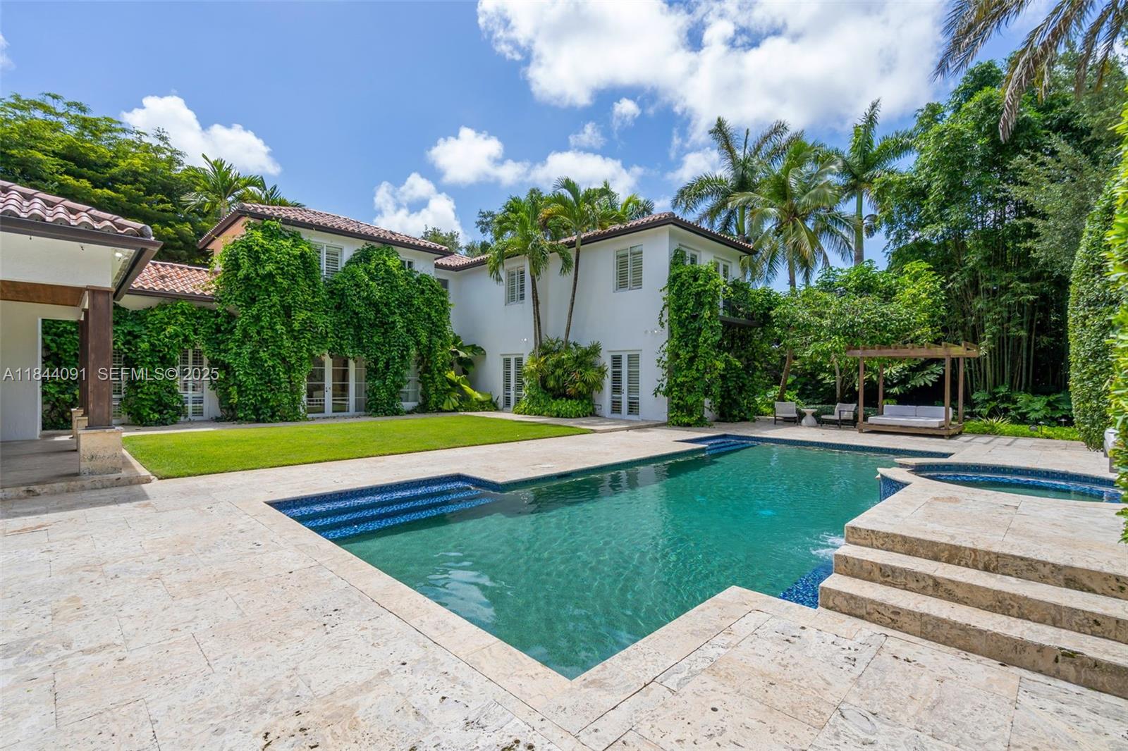 7320 Southwest 79th Court Miami, FL 33143 - Photo 8 of 89 a view of a house with swimming pool and a yard