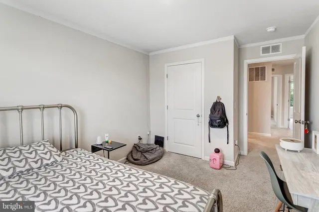 a bedroom with furniture and natural light