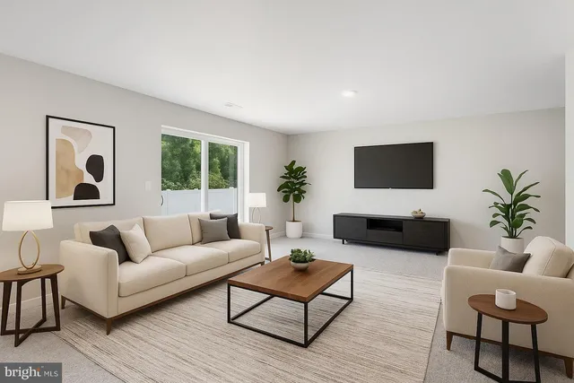 a living room with furniture a large window and a flat screen tv