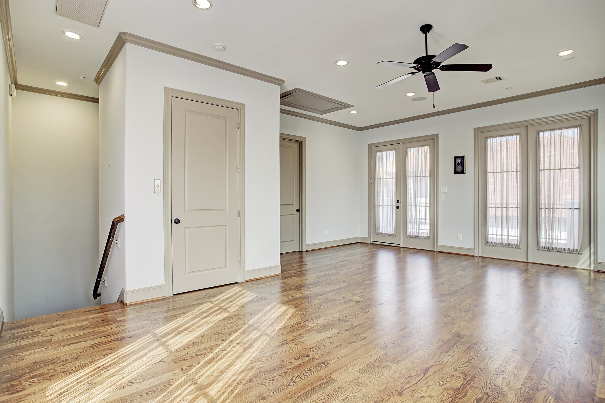 1307 Rosedale Street Houston, TX 77004 - Photo 24 of 32 a view of an empty room with a window and wooden floor