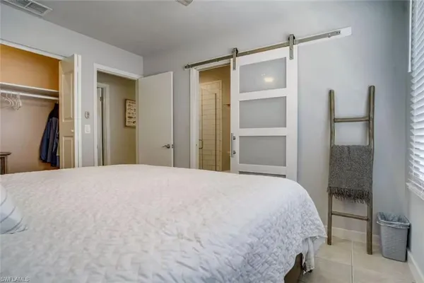 a bedroom with a bed and a dresser