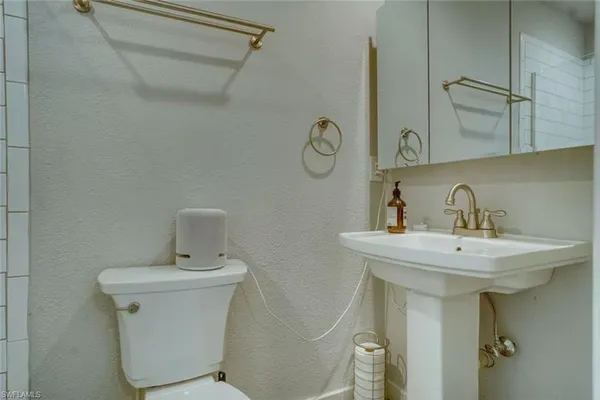 a bathroom with a sink and mirror