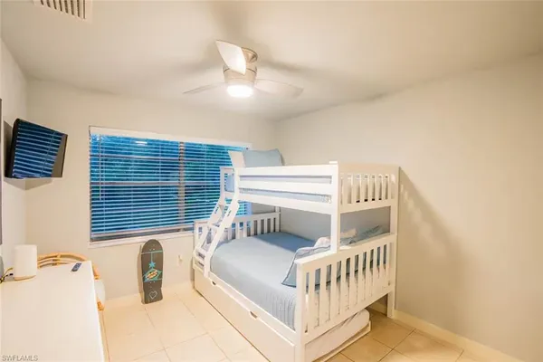 a bedroom with furniture and a window