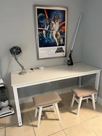 a view of a workspace with furniture