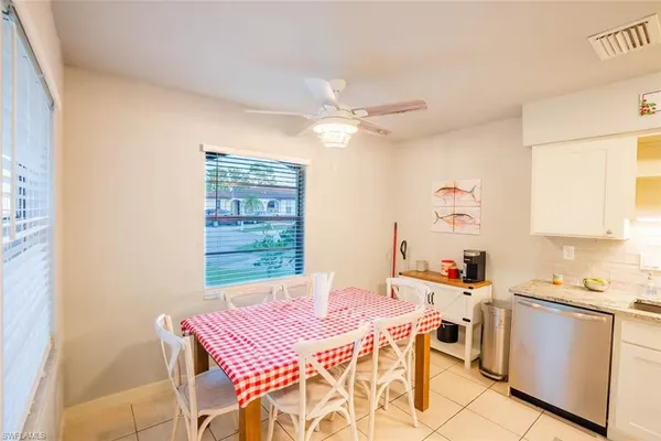 a view of a dining room that has a table and chairs in it