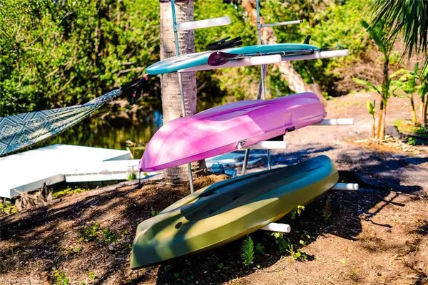 a view of a balcony with chairs and a fire pit