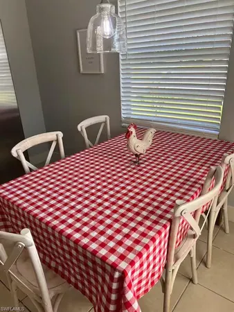 a bedroom with a bed and a lamp