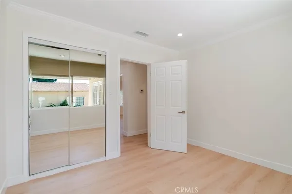 an empty room with sliding glass door