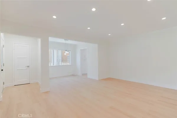 a view of an empty room with windows