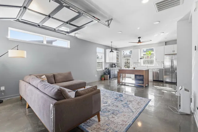 a living room with furniture and a table