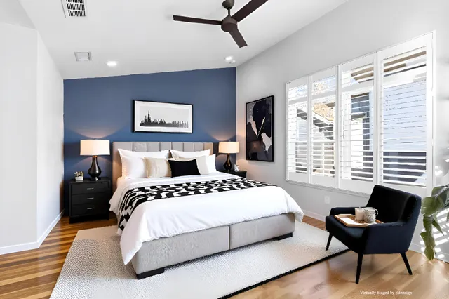 a bedroom with a bed and a couch