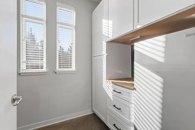a bathroom with a window and a shower