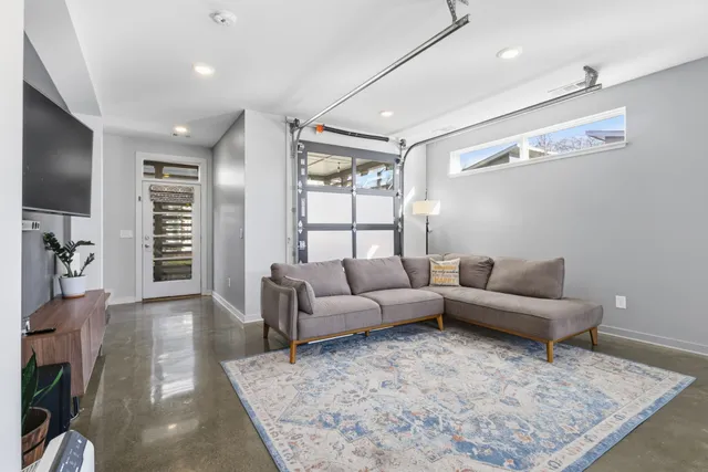 a living room with furniture and a rug