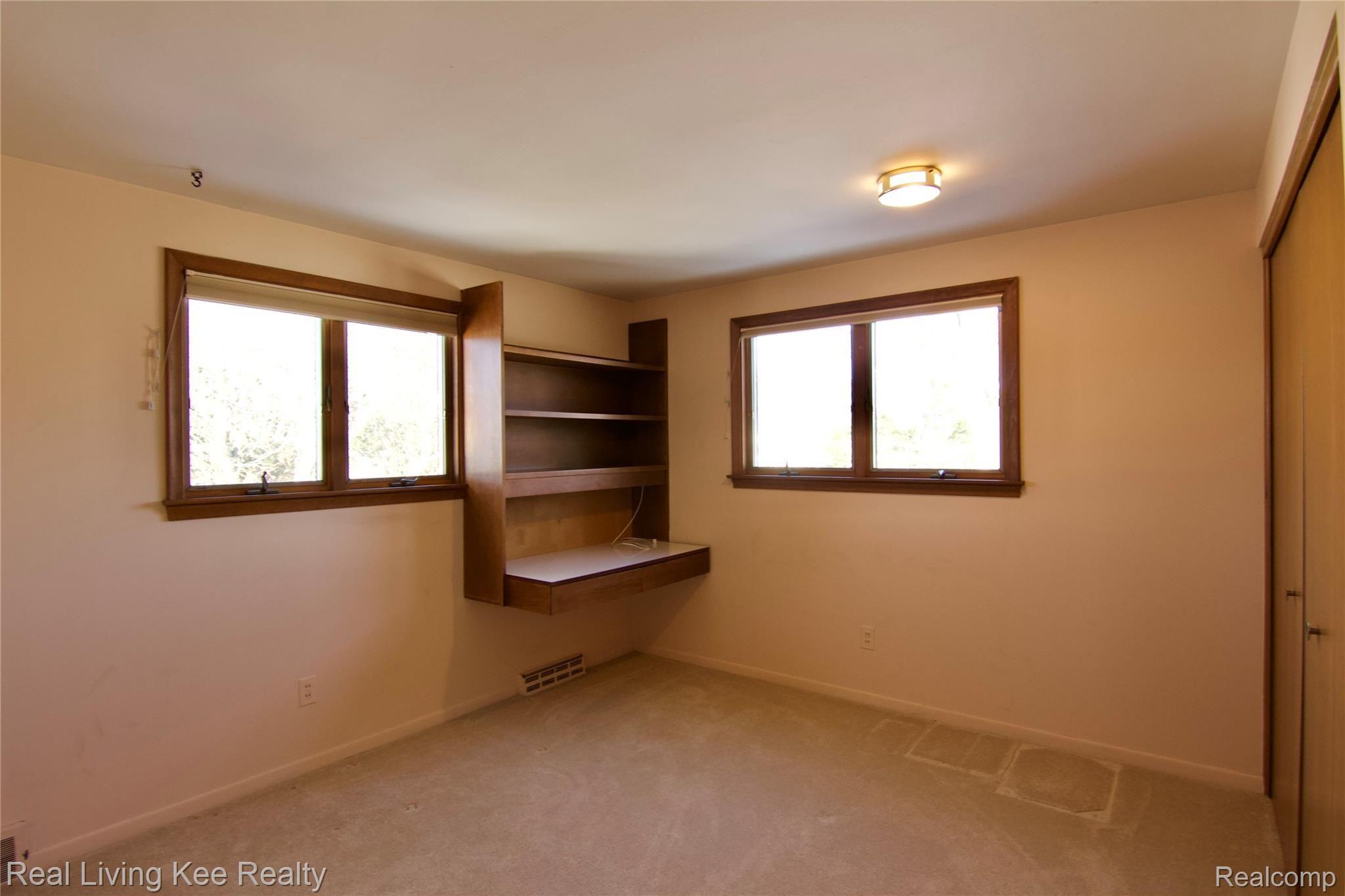 1859 Fair Oak Court Rochester, MI 48309 - Photo 21 of 36 Updated Andersen windows and a charming built-in desk.