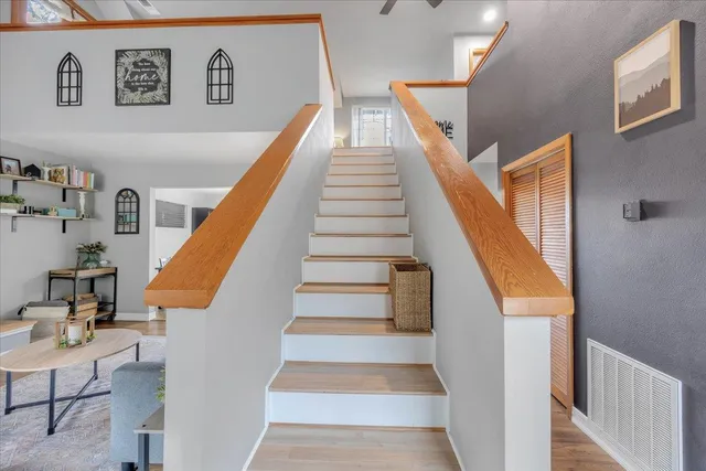 a living room with furniture and a rug