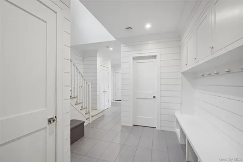 a bathroom with a shower and closet
