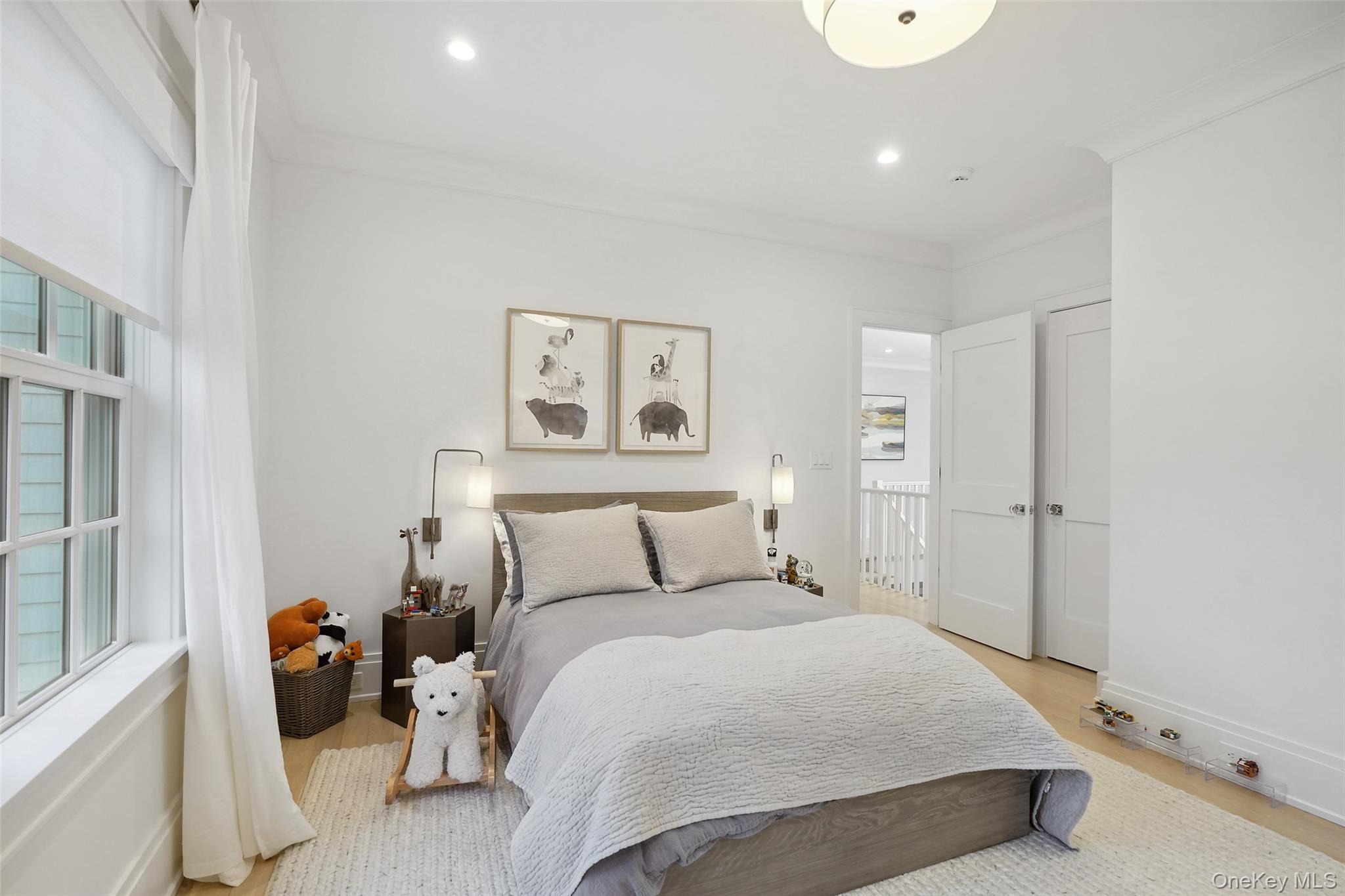 25 Hunt Place Rye, NY 10580 - Photo 21 of 44 a bedroom with a bed and wooden floor