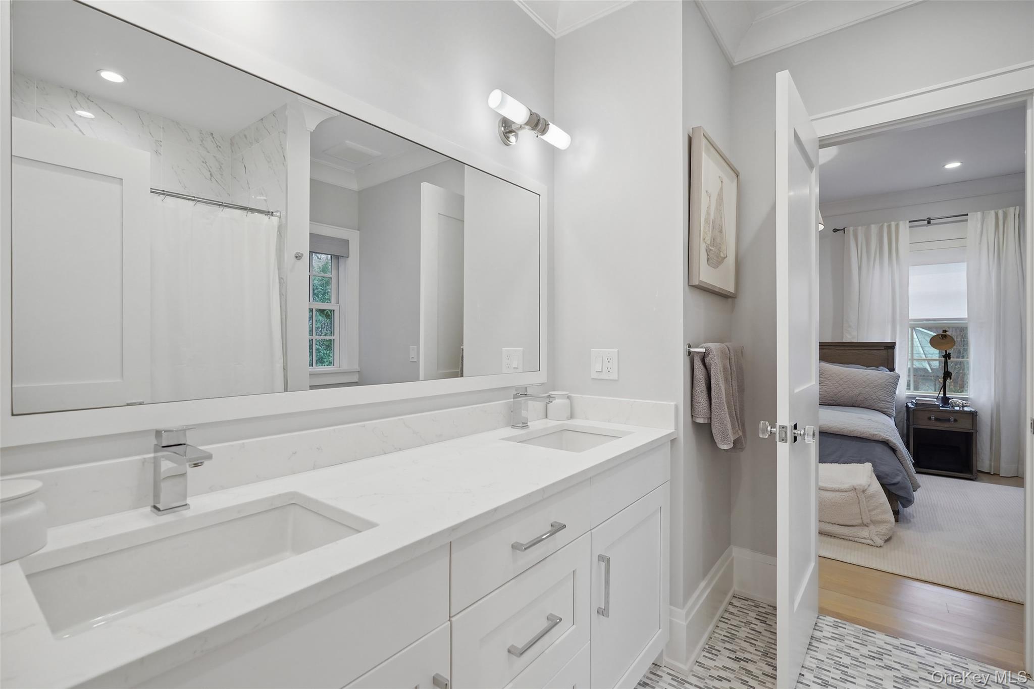 25 Hunt Place Rye, NY 10580 - Photo 22 of 44 a en suite bathroom with double sink and a mirror