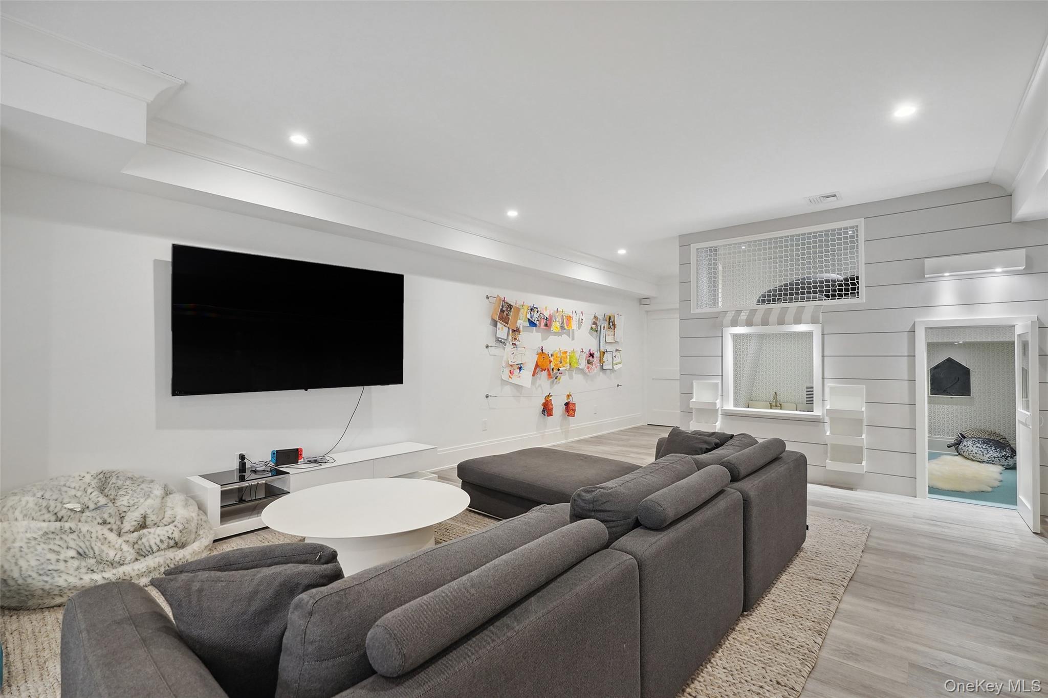 25 Hunt Place Rye, NY 10580 - Photo 23 of 44 a living room with furniture and a flat screen tv