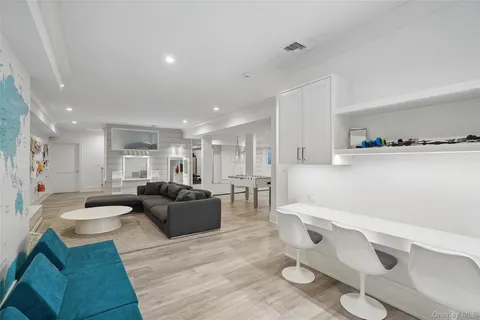 a view of walk in closet and living room