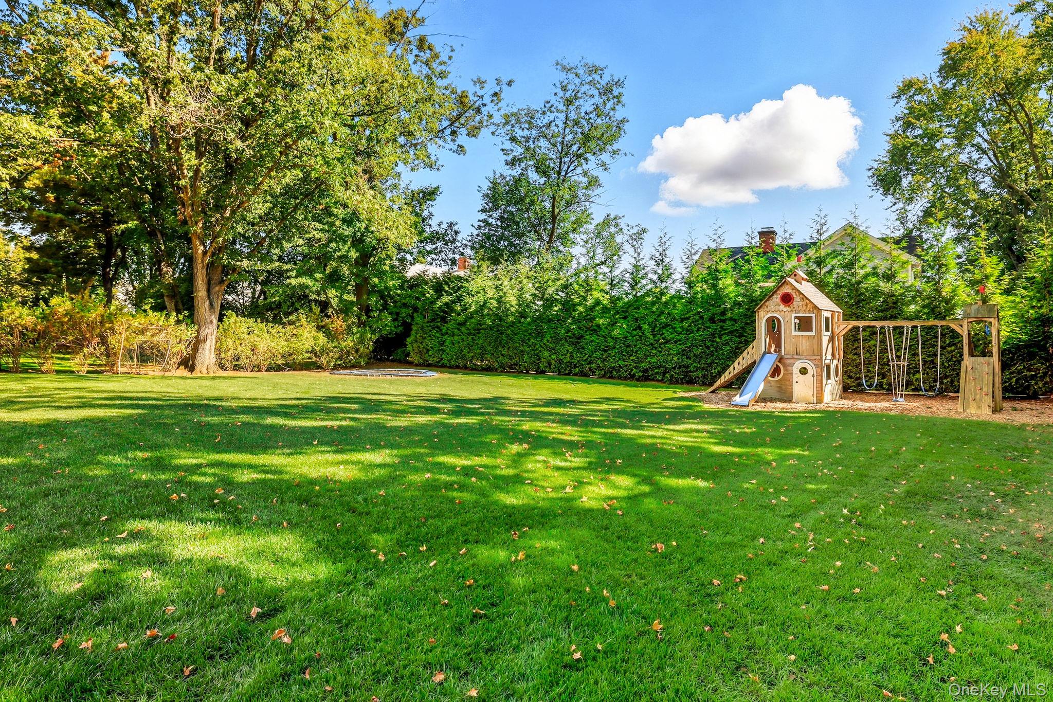 25 Hunt Place Rye, NY 10580 - Photo 41 of 44 a view of a golf course with a garden
