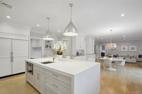 a view of living room with granite countertop furniture and a chandelier