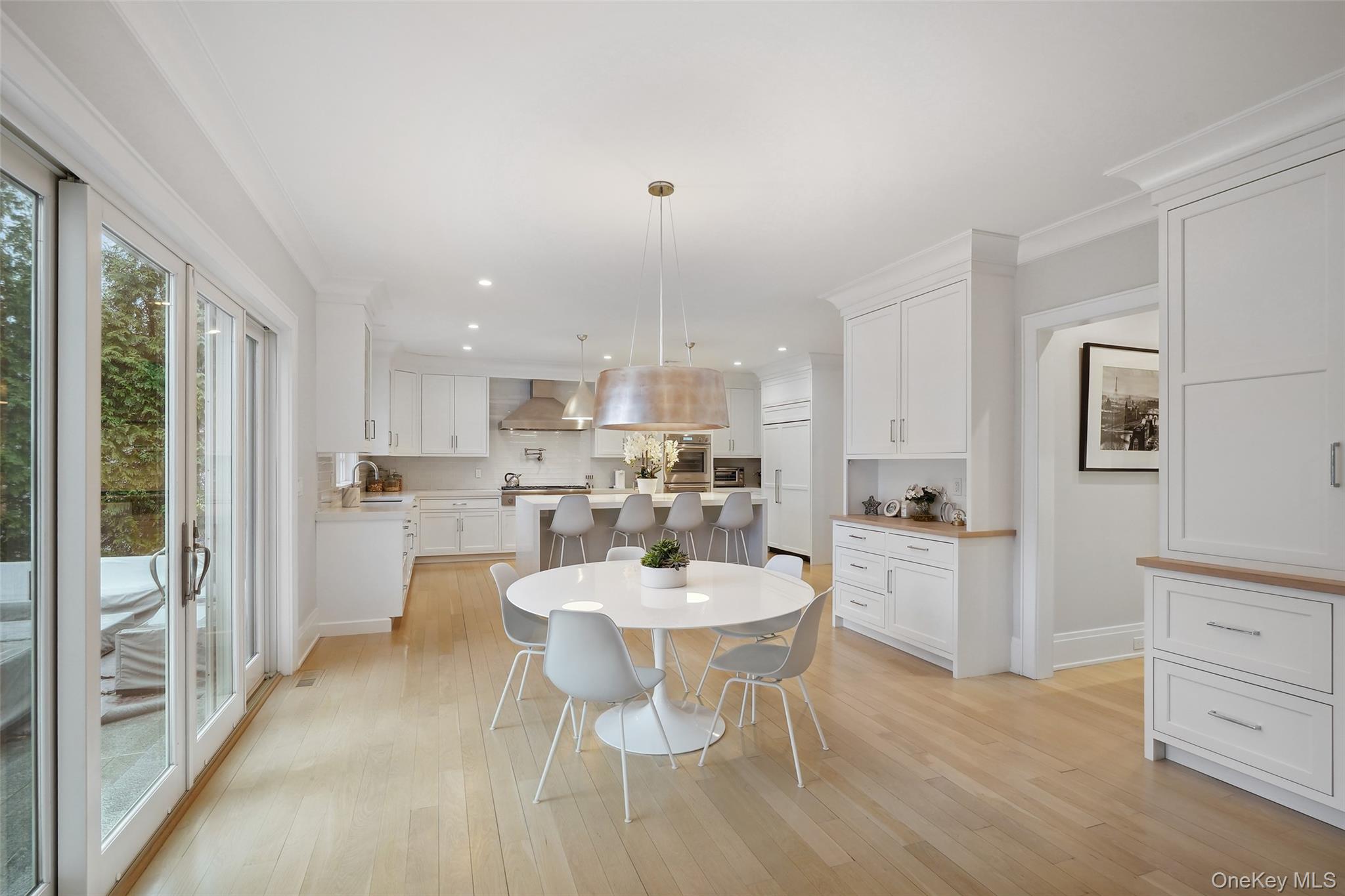 25 Hunt Place Rye, NY 10580 - Photo 9 of 44 a view of a dining room with furniture and wooden floor