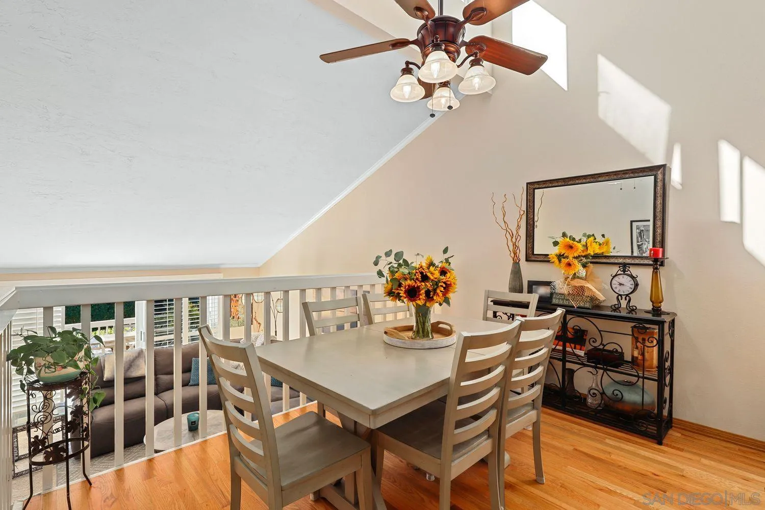 1818 Wilton Road Encinitas, CA 92024 - Photo 16 of 53 a view of a dining room with furniture wooden floor and chandelier