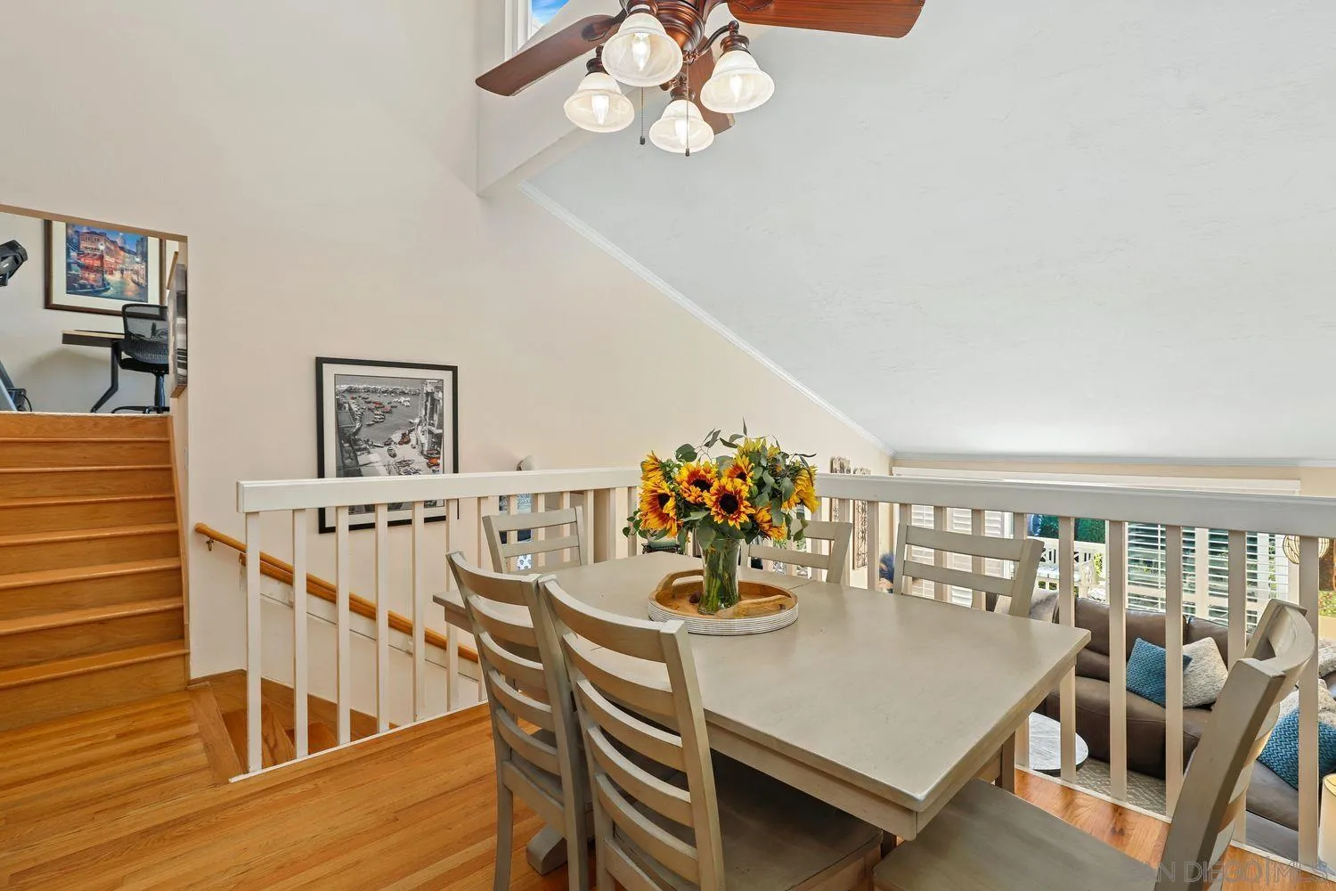 1818 Wilton Road Encinitas, CA 92024 - Photo 17 of 53 a view of a dining room with furniture a chandelier and wooden floor