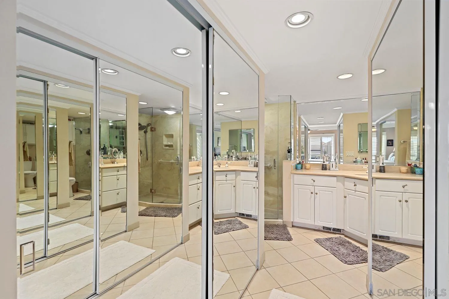 1818 Wilton Road Encinitas, CA 92024 - Photo 28 of 53 a bathroom with a shower sink and mirror