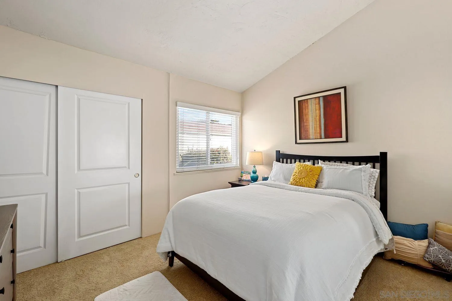 1818 Wilton Road Encinitas, CA 92024 - Photo 31 of 53 a spacious bedroom with a bed and a window