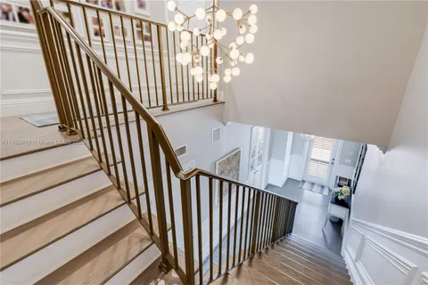 a view of a hallway with a chandelier
