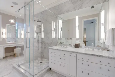 a bathroom with a toilet tub and shower