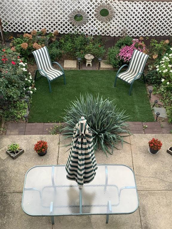 122 28th Avenue Brooklyn, NY 11214 - Photo 3 of 28 a view of a garden with patio
