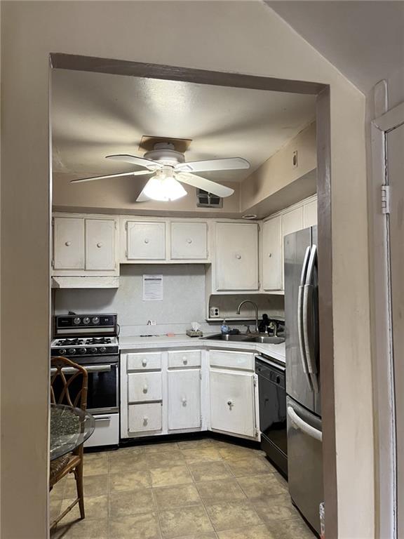 122 28th Avenue Brooklyn, NY 11214 - Photo 6 of 28 a kitchen with stainless steel appliances a stove a sink and cabinets