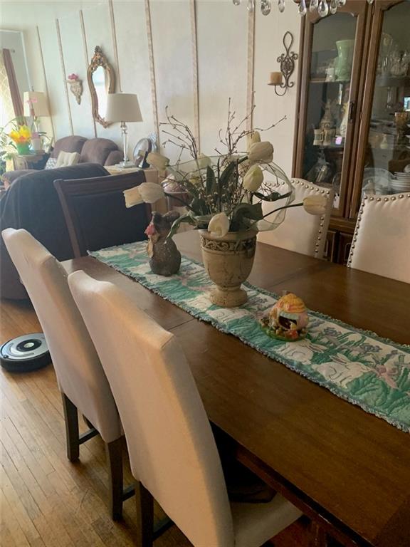 122 28th Avenue Brooklyn, NY 11214 - Photo 8 of 28 a dining room with furniture and wooden floor