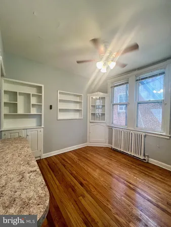 a bedroom with furniture window and wooden floor