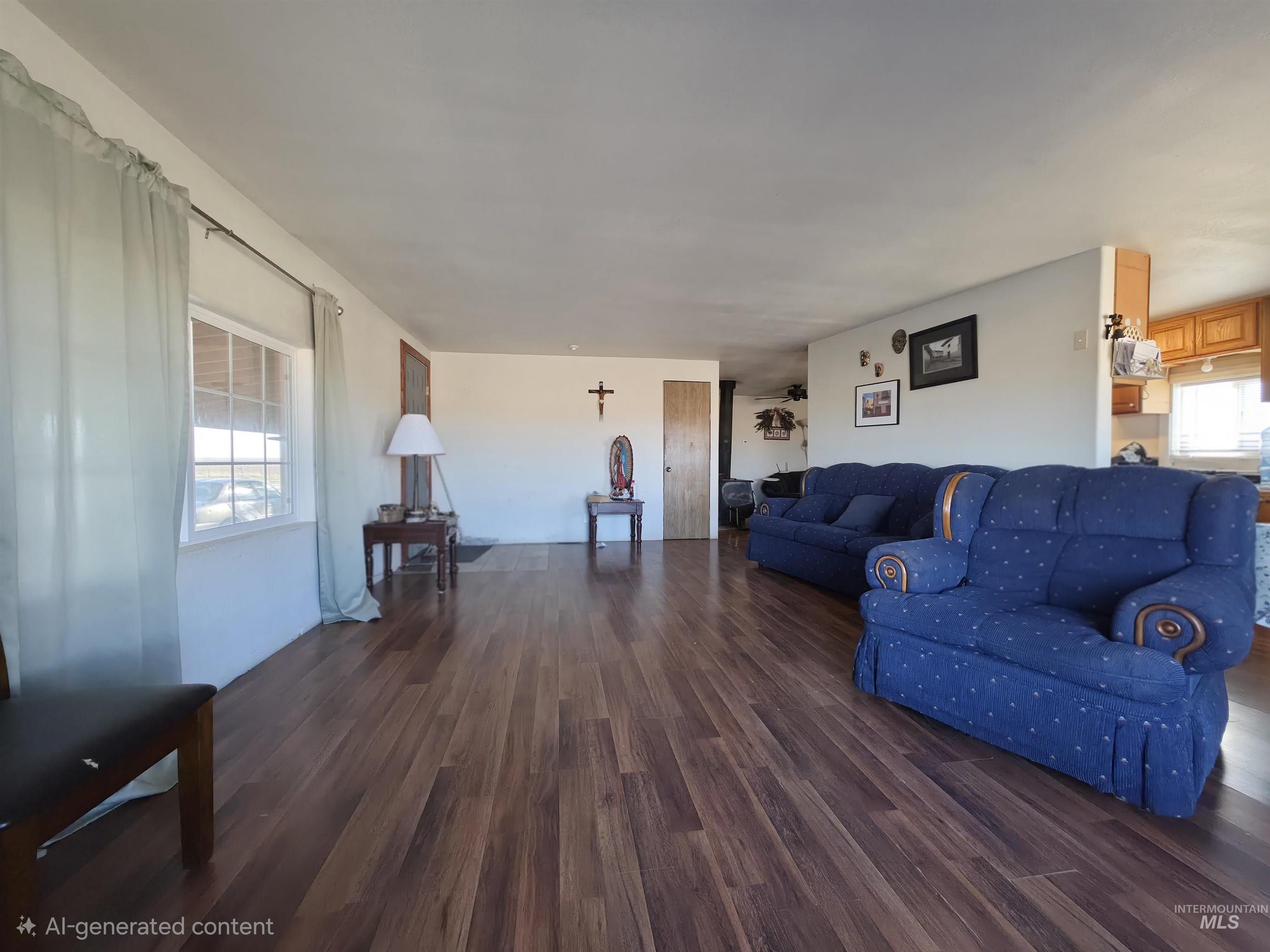236 West 600 North Rupert, ID 83350 - Photo 13 of 29 Living area with dark wood finished floors