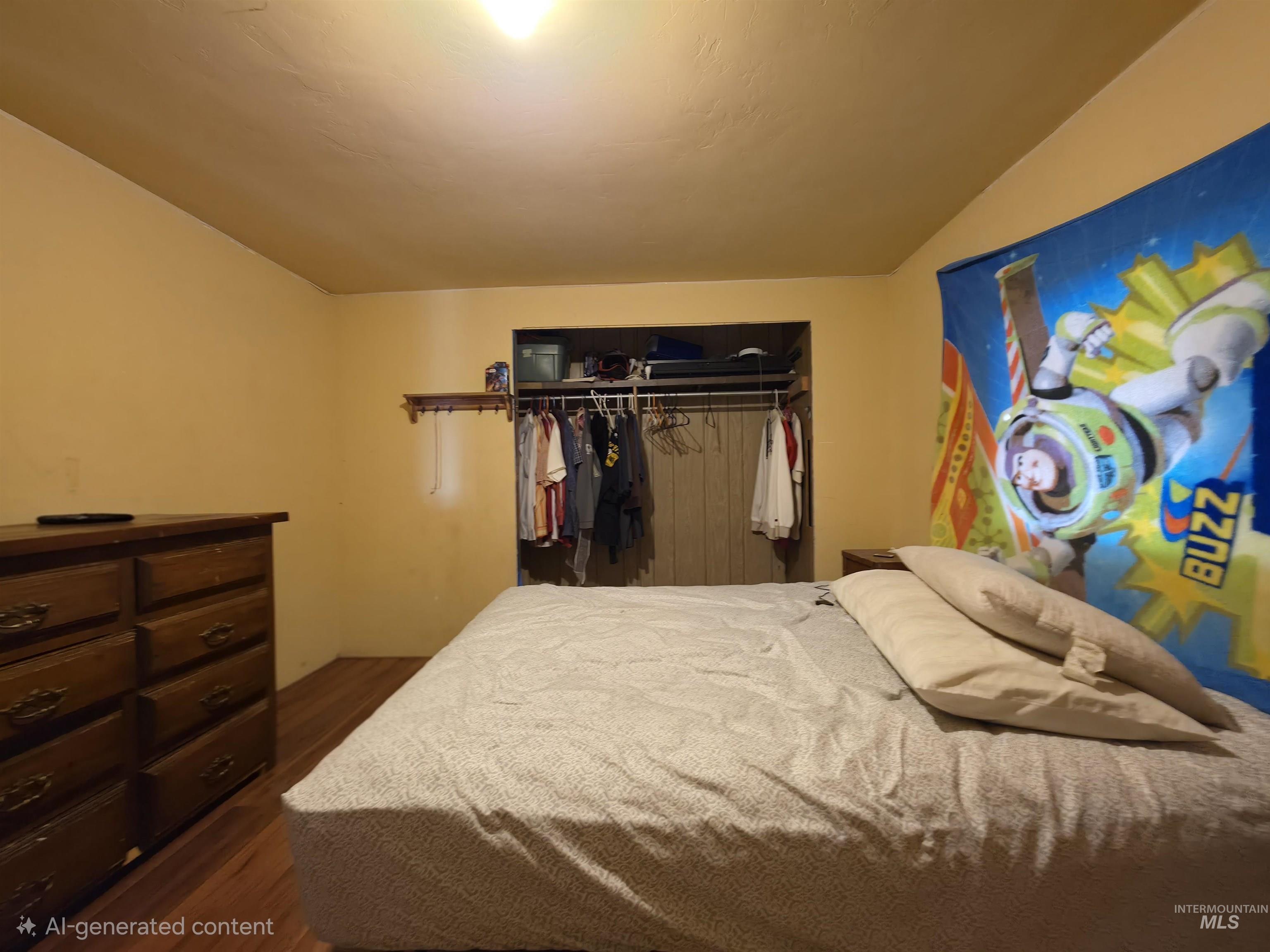 236 West 600 North Rupert, ID 83350 - Photo 19 of 29 Bedroom with dark wood finished floors, a closet, and vaulted ceiling