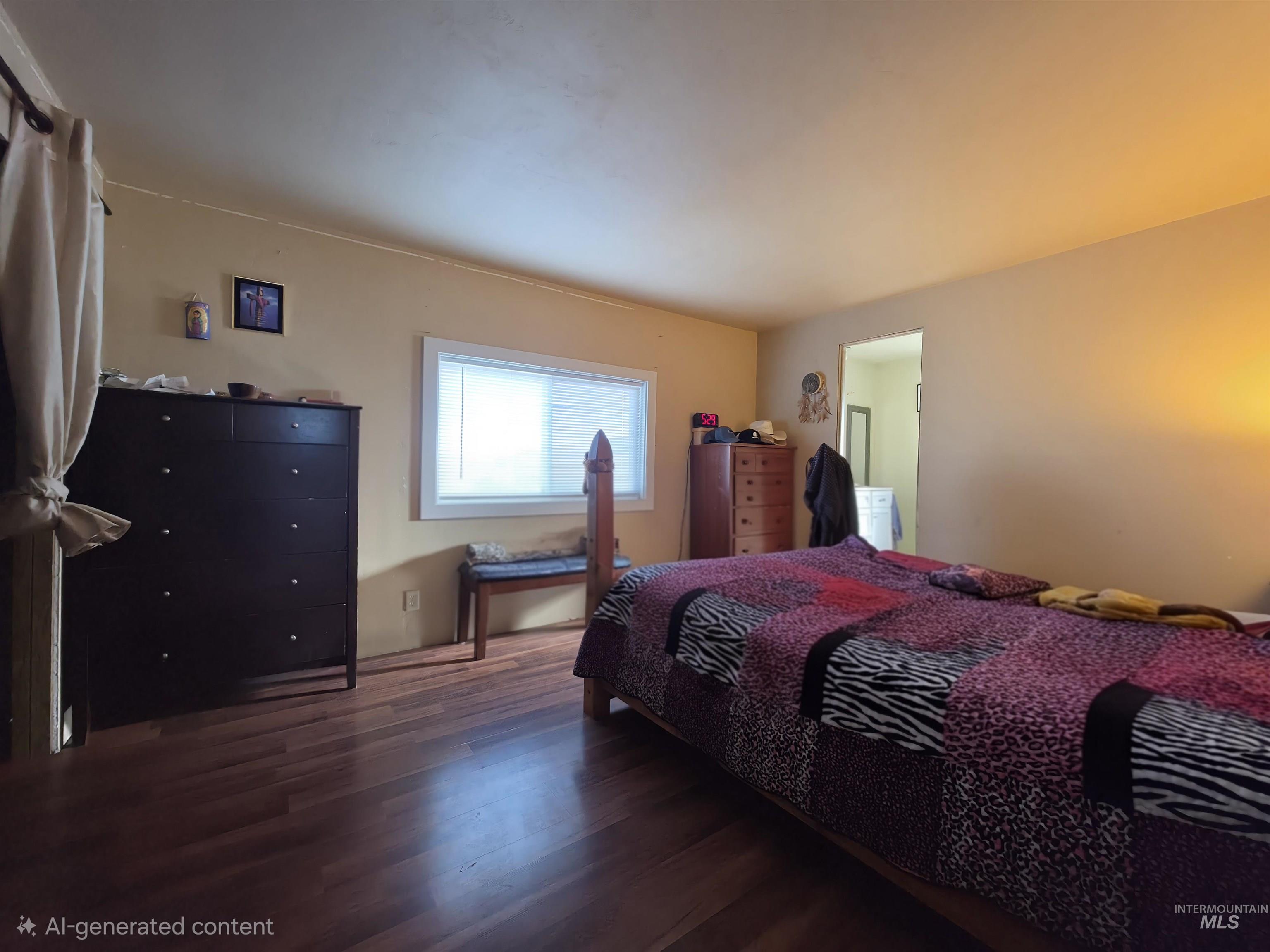236 West 600 North Rupert, ID 83350 - Photo 25 of 29 Bedroom featuring dark wood finished floors