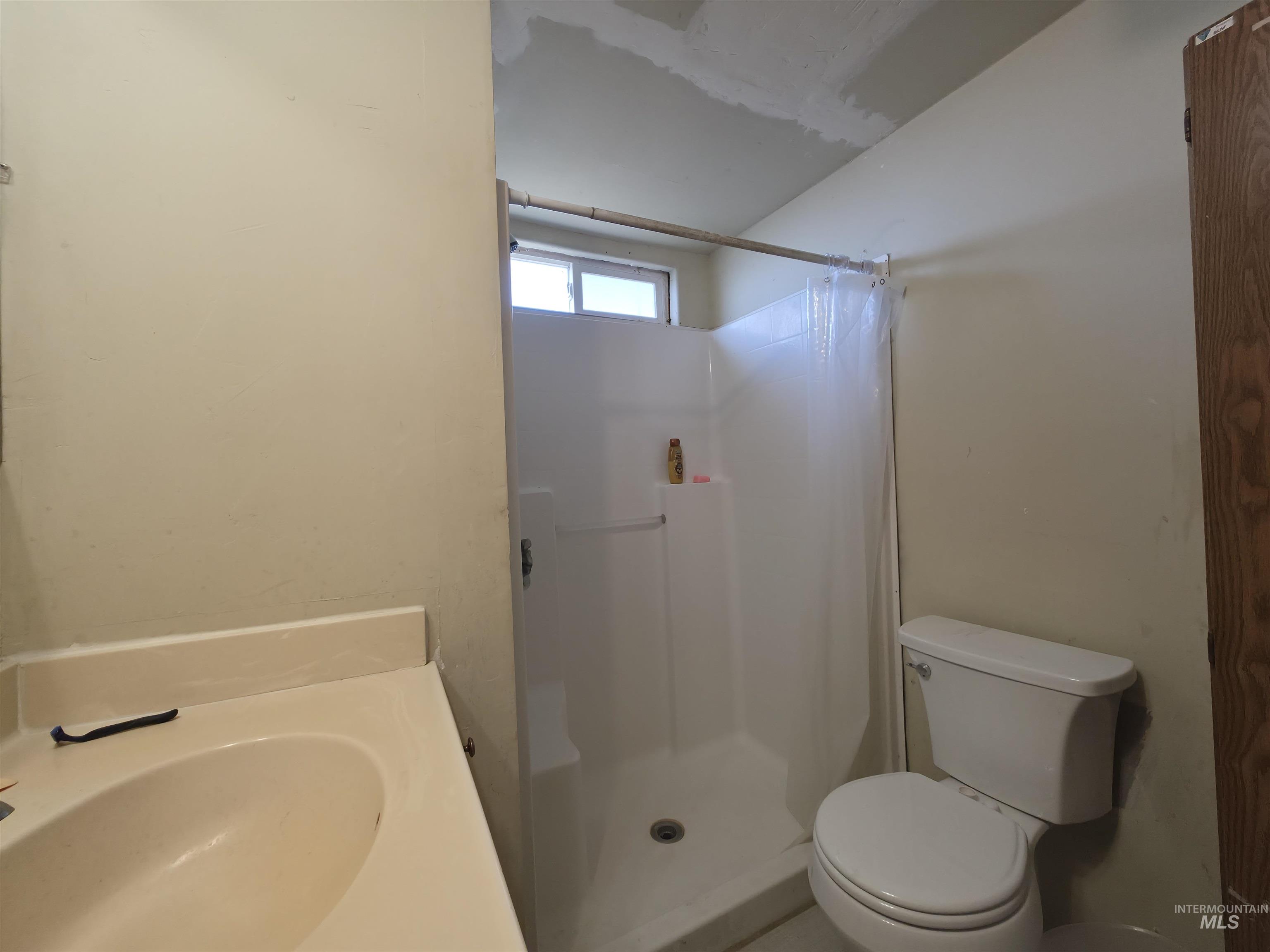 236 West 600 North Rupert, ID 83350 - Photo 26 of 29 Bathroom featuring vanity and a shower stall