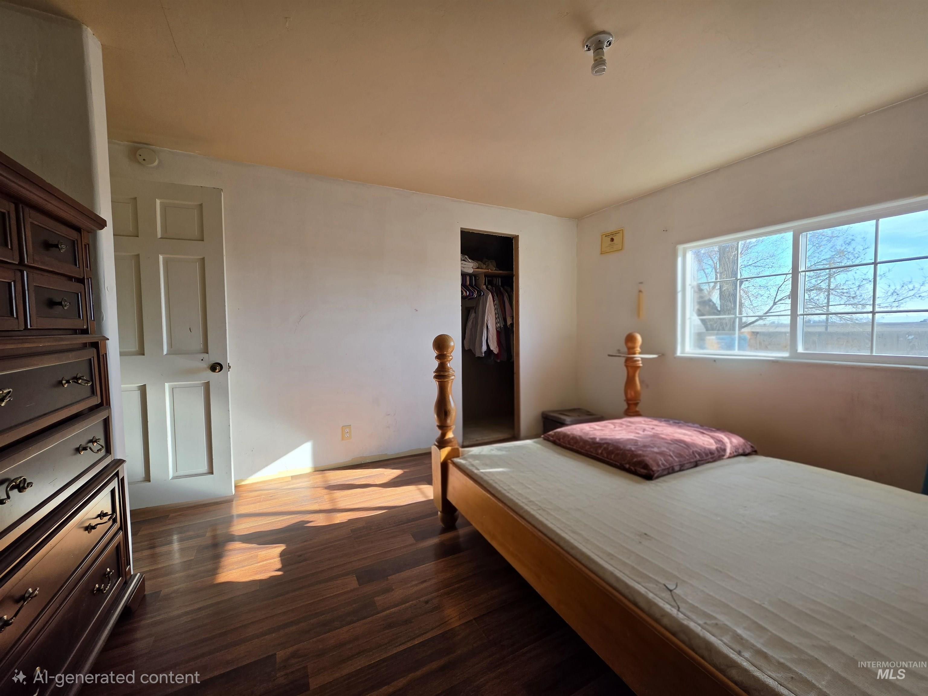 236 West 600 North Rupert, ID 83350 - Photo 27 of 29 Bedroom featuring dark wood-style floors and a closet