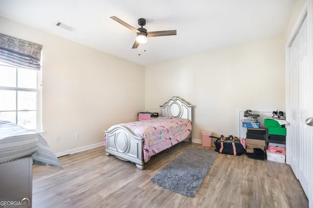 a bedroom with a bed and a table