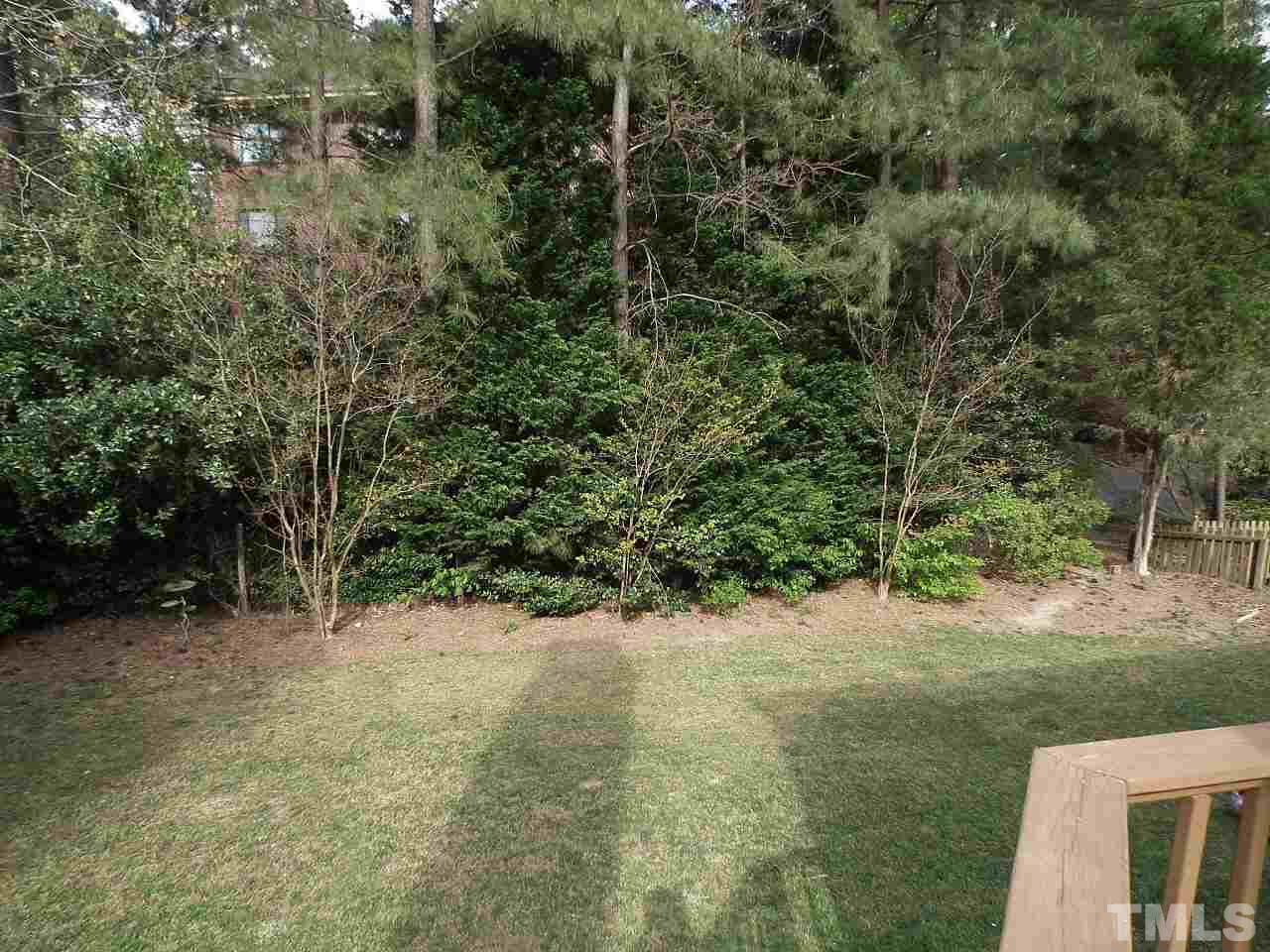 7016 Edgeview Court Raleigh, NC 27613 - Photo 22 of 25 a view of a yard with a tree