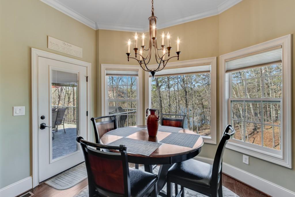 2152 Silver Circle Gainesville, GA 30501 - Photo 17 of 46 a view of a dining room with furniture wooden floor and chandelier