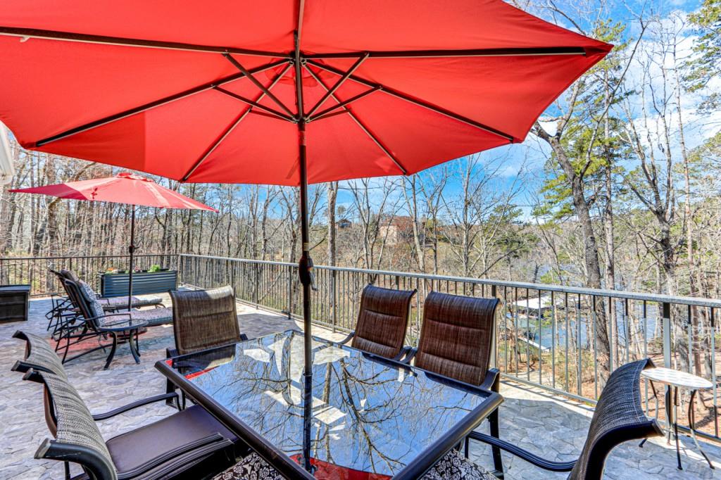 2152 Silver Circle Gainesville, GA 30501 - Photo 18 of 46 a patio with a patio table and chairs under an umbrella