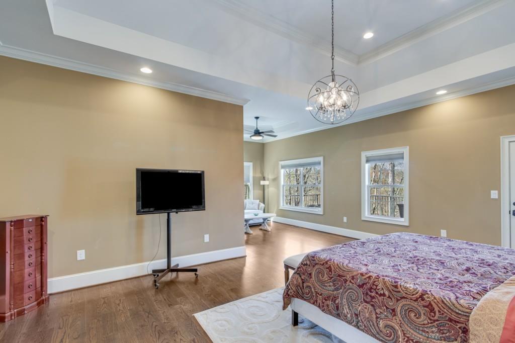 2152 Silver Circle Gainesville, GA 30501 - Photo 19 of 46 a bedroom with a bed and a flat screen tv