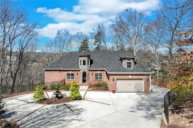 a front view of a house with sitting area